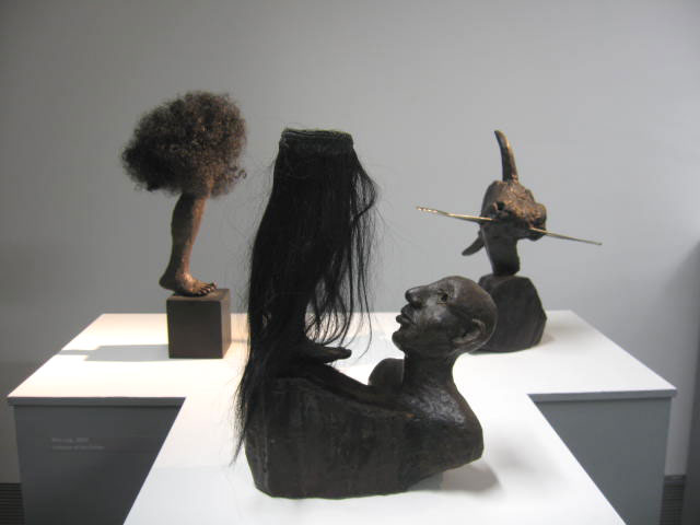 Left to Right - Afro Leg 2003, wax, wood, hair. Salome Before the Dance 2002, wax, hair. The Remains of Captain Bull #1 2001, wax, wood, steel.